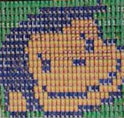 green, blue, and yellow cans stacked to form a picture of curious george's face