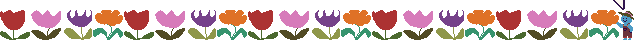 a bed of flowers with a little gardener