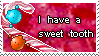a stamp that says 'I have a sweet tooth' with characters licking a candy cane